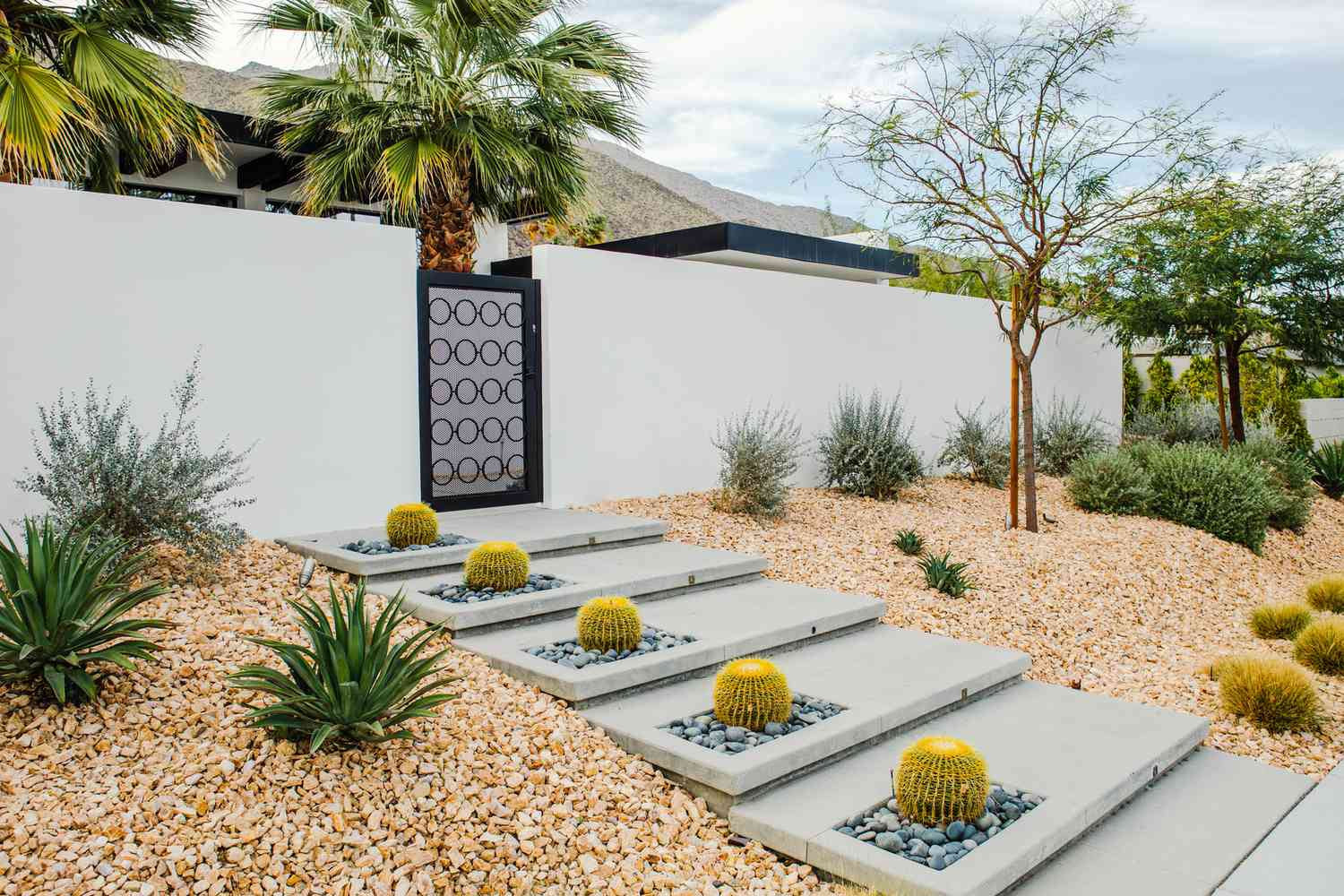 12 Stunning Modern Backyard Ideas (No Grass Needed) 1 Patios form the foundation of a sophisticated, grass-free backyard.
