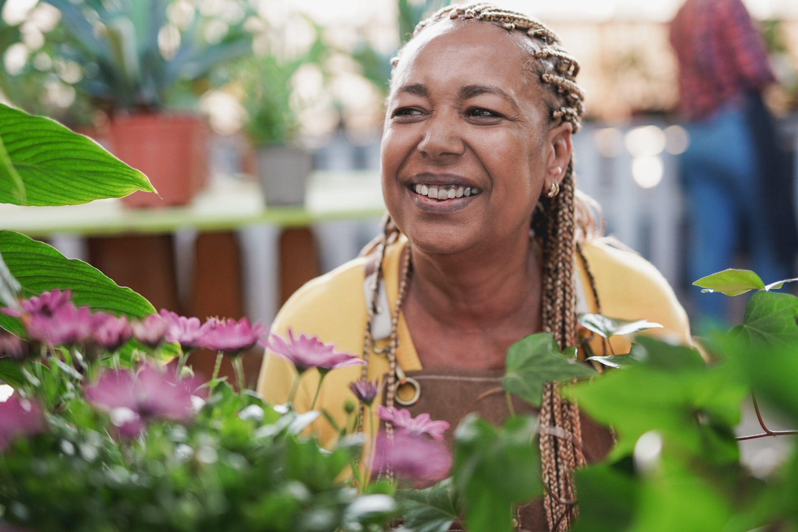 Fiberglass Planters for Nursing Homes: Interior Design Ideas & Mental Health Benefits 6 african senior woman working inside garden greenho 2025 03 10 10 21 41 utc scaled
