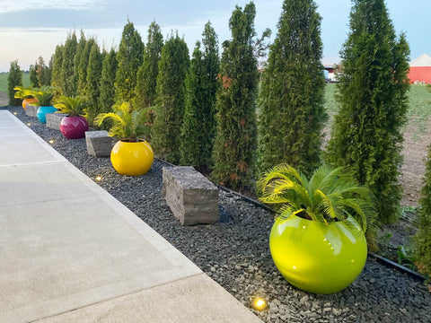 Variety of customized planters in different colors and sizes