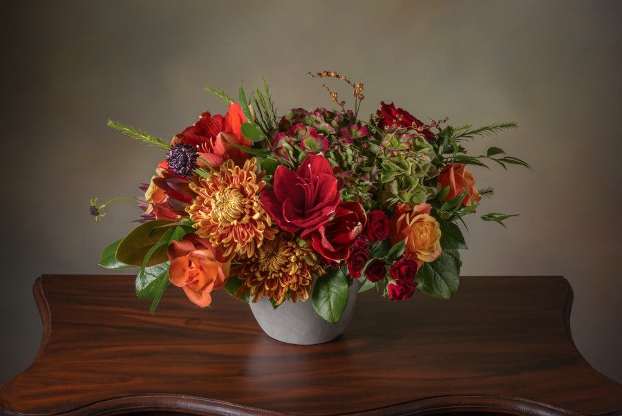 Fresh flower arrangement in bold autumn colors
