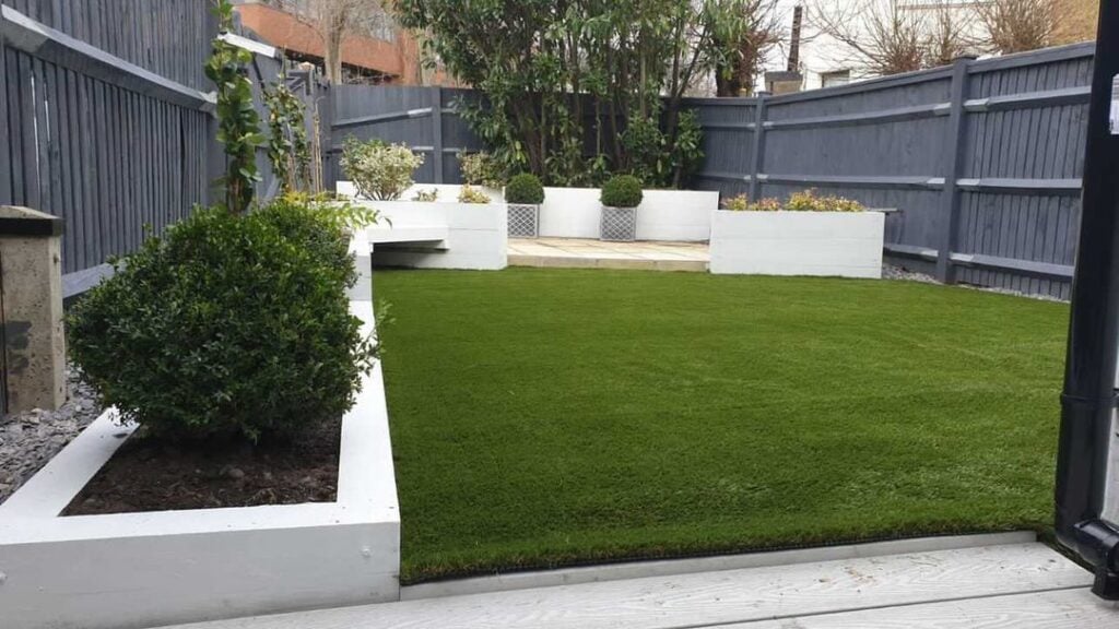 12 Stunning Modern Backyard Ideas (No Grass Needed) 4 Artificial turf provides a lush, green look with zero maintenance.